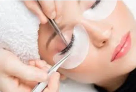 Photo of woman's face with eyelashes being done
